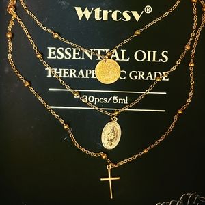 Gold necklace with golden cross and virgin Mary